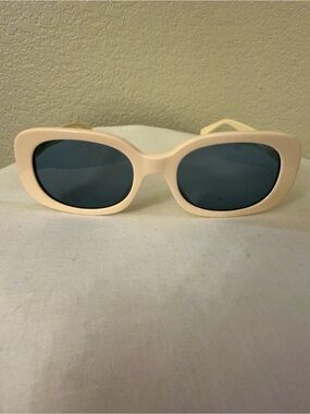 Coach Cream Frame Sunglasses with Dark Blue Lenses